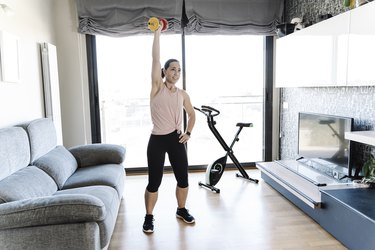 Woman Flexing Biceps In Studio Foto de stock - Getty Images