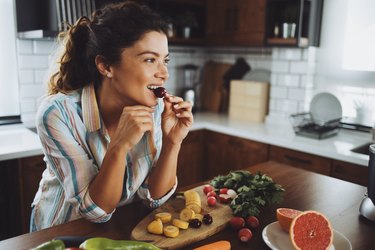 A young smiling woman having healthy breakfast in the morning with yeast-free foods