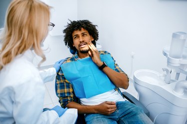 Man having toothache at dentist