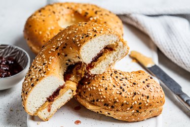 Bagels with peanut butter and berry jam as an example of what to eat before sports tryouts.