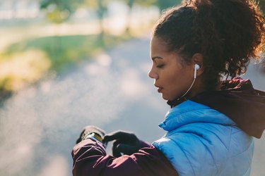 Woman checking heart rate after sports training