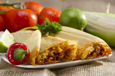 Plate of healthy tamales with fresh vegetables