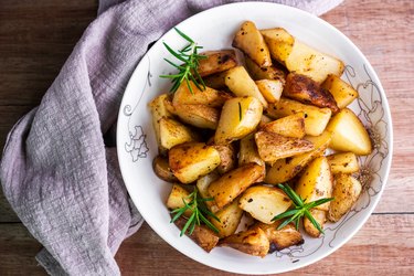 Top view of roasted potatoes with rosemary