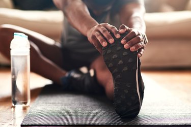 a person stretching after exercise, as a natural remedy for dandruff