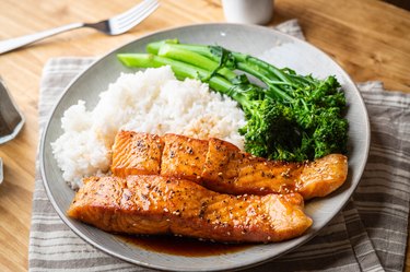 Honey salmon on plate, served with white rice and broccoli.