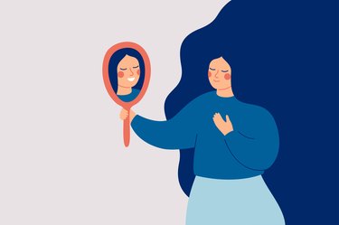 Illustration of a woman looking in a hand mirror and smiling, to show self-compassion and positive self-talk