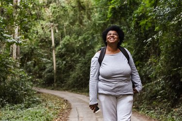 woman walking in nature, as a natural remedy for anxiety