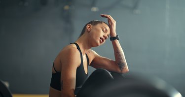 a person feeling anxious in the gym after taking creatine