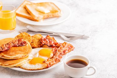 unhealthy Breakfast with Bacon and Pancakes