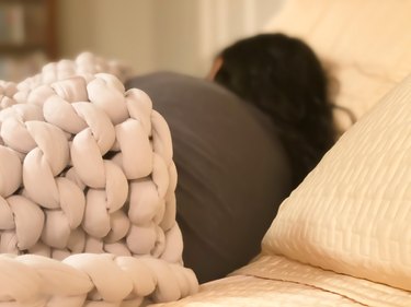 unrecognizable mixed-race female soundly sleeping under weighted blanket