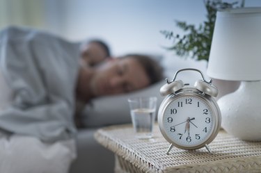 An alarm clock set for a consistent time as a way to get better sleep