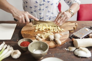 a person chopping ginger, as a toothache remedy