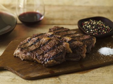 Steak dinner with peppercorn and salt seasonings