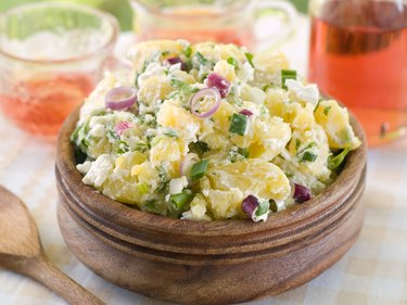 Bowl of potato salad on picnic table