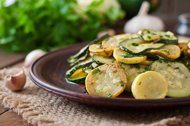 Warm salad with young zucchini with garlic and herbs