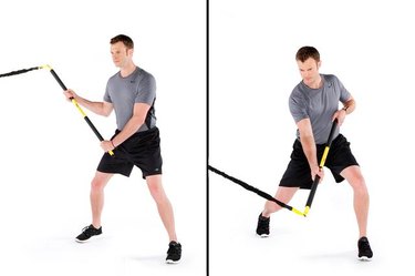 Man performing rip hockey slapshot TRX exercise