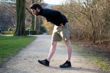 Man performing heel-toe walks before a bike ride