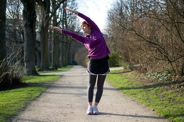 Woman doing Side Stretches before running