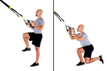 Man performing crossing balance lunge TRX exercise