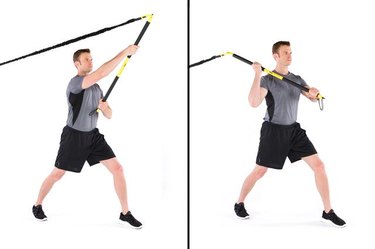 Man performing rip overhead axe chop TRX exercise
