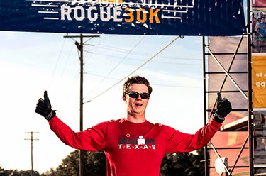 Man crossing finish line of a race