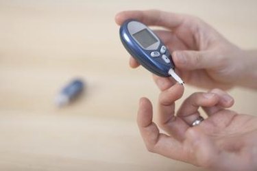 person with diabetes testing blood sugar