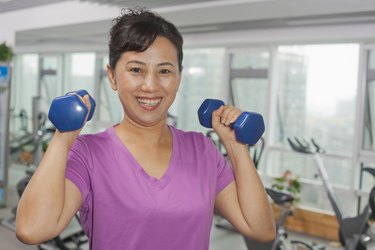 Woman exercising with weights