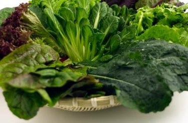 leafy greens in basket as example of foods low in phosphorus