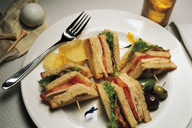 Clubhouse sandwich with golf ball and tee