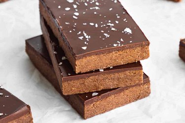Three no-bake chocolate protein bars stacked