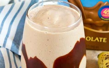 Chocolate Peanut Butter Protein Smoothie Recipe in a Glass With Chocolate Sauce