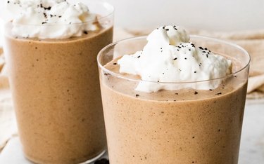Coffee Protein Smoothie in Two Glasses With Whipped Cream on Top