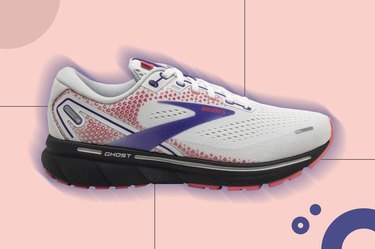 a white, purple and pink Brooks running ghost 14 shoe on a pink background