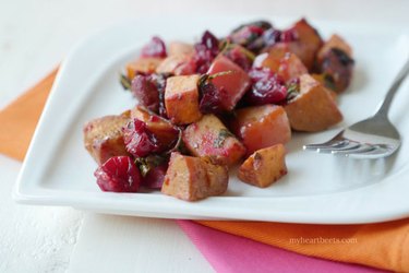 Cranberry apple sweet potato bake on a white dish.