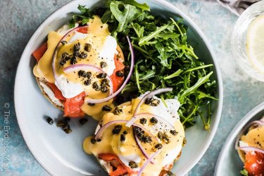 Smoked salmon eggs Benedicts with onions, capers and hollandaise sauce