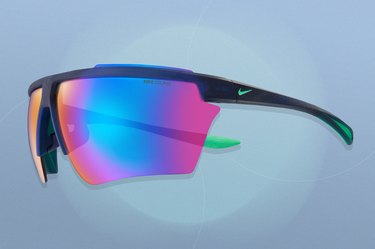 Nike Windshield Pro Course Tint running sunglasses on a blue background
