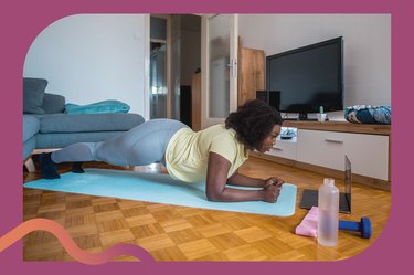 Person with curly hair wearing leggings and a t-shirt does a forearm plank as part of the 4-week plank challenge in their living room