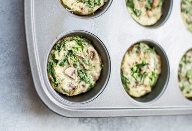 Spinach, eggs and mushrooms are combined together in a muffin tin for an easy, portable breakfast