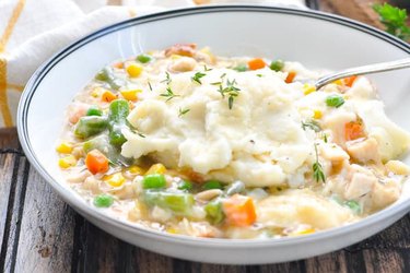 white bowl of Shepherd's Pie with mashed potatoes on top