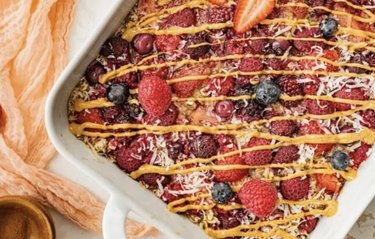 a sheet of baked oatmeal with berries on top