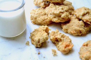 Sweet potato maple pecan breakfast cookies with a glass of milk.