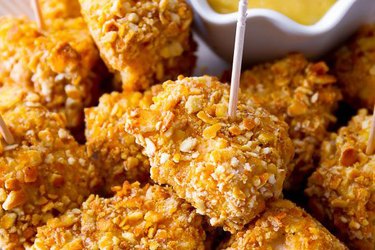 Pretzel chicken nuggets on a plate.