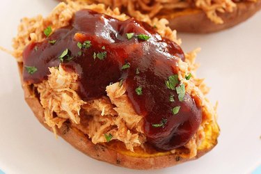 Sweet potato stuffed with shredded chicken drizzled in barbecue sauce.