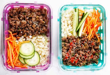 Ground Beef Bowls with vegetables and rice in meal prep containers