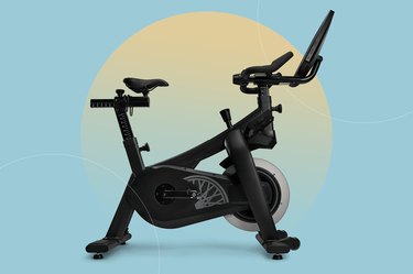 SoulCycle At-Home Bike isolated on a light blue background