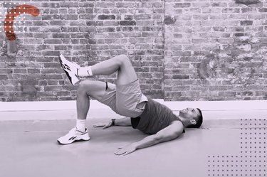 Fit personal trailer does single-leg glute bridges as part of the LIVESTRONG.com 5 Minutes of Movement Challenge