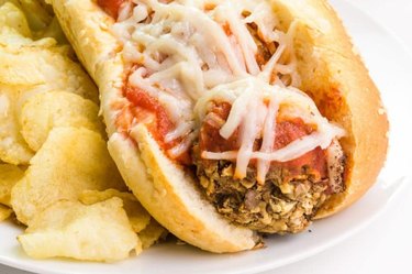 Vegan Meatball Sub on a white plate and table