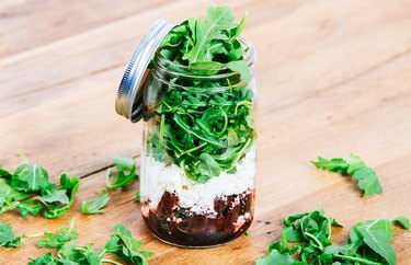 Lemongrass, Beet and Feta Mason Jar Salad on a wooden table.