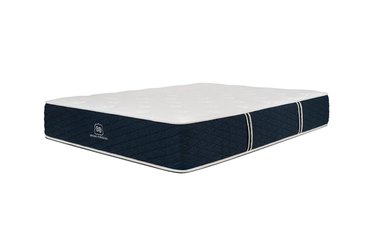 A white and navy blue mattress on a white background