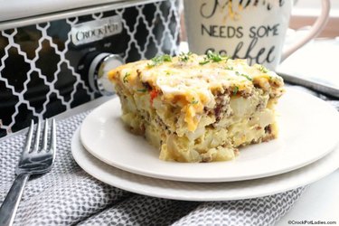 Crock-Pot fully loaded breakfast casserole on two white plates